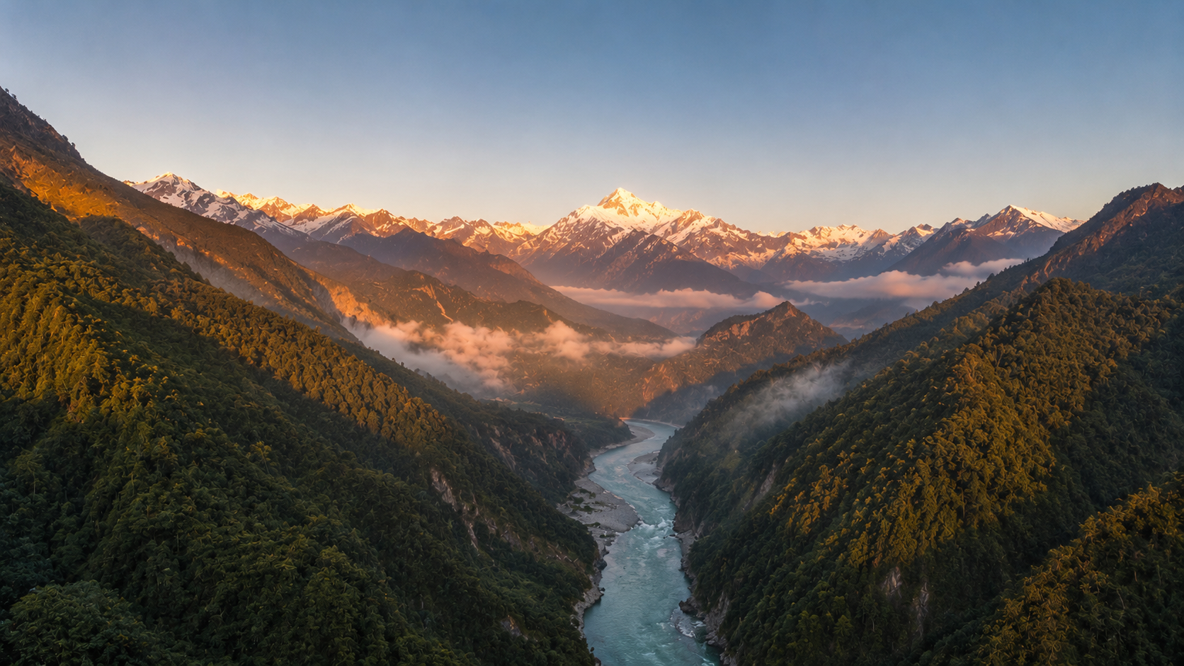 A Himalayan river winding through a deep forested gorge below a snow peak lit by sunrise